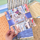 Packaging of 'Coastal Charm' paper with scenic images on a wooden surface.