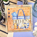 Birthday card with beach theme featuring a bag, sun cream, and seashells on a starfish patterned background.