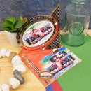 Decorative items including a trophy, card, and plant on a table.