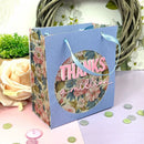 Floral gift bag with 'Thanks a million' text on a decorative background