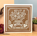 Decorative wall art with floral design and 'with love' text on a brown background