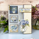 Decorative wall art with floral designs and text on a wooden surface.