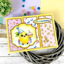 Birthday card with a lemon character holding a cupcake, surrounded by decorative buttons and plants.