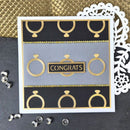 Greeting card with gold jewelry illustrations and 'Congrats' text on a decorative background.