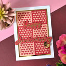Card with 'Happy Anniversary' text and heart patterns on a pink and red background