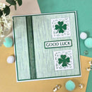 Greeting card with shamrock designs and 'Good Luck' text on a decorative background.