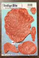 IndigoBlu coral rubber stamp set on a blue cardstock background