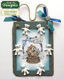 Decorative sign with teddy bears and baby owl illustration, featuring Katy Sue Designs branding.