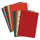 Stack of red and green patterned paper sheets on a white background