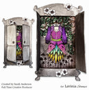 Decorative cabinet with a colorful outfit and floral details, created by Lavinia Stamps.