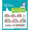 Lawn Fawn photopolymer clear stamps with garden hats design on a blue background