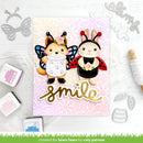 Card with cartoon fox and rabbit characters wearing insect costumes, surrounded by crafting supplies.
