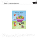 Card with a wheelbarrow and flowers on a blue background, featuring the brand 'Lawn Fawn'.