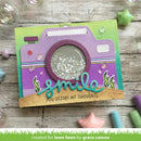 Card with purple camera design and 'smile' text on a wooden surface