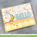 Handmade card with 'hello' text and banana illustration on a textured surface