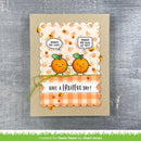 Card with cartoon oranges and text on a textured surface