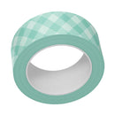 Roll of green checkered tape on a white background