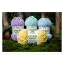 Four balls of yarn in pastel colors with 'Posh Twist' labels on a grassy background.