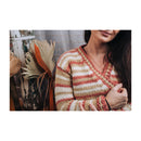 close up of a knitted stripped cardigan