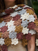Multicolored crocheted shawl with star patterns