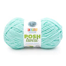 Turquoise skein of yarn with a 'Cover Story' label on a white background