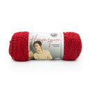 Red skein of yarn with Lion Brand label on a white background