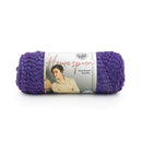 Purple skein of yarn with a label on a white background