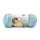 Blue skein of yarn with Lion Brand label on a white background