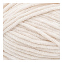 Close-up of beige yarn on a white background