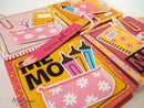 Colorful stationery items with 'Mum' design on a white background