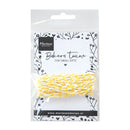 Packaged yellow baker's twine with Marianne Design branding on a white background