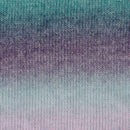 Knitted fabric with a gradient of blue and purple colors.