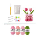 Crochet kit with yarn, hooks, and a completed crochet flower on a white background