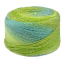 Green and blue yarn ball on a white background