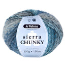 A ball of Patons Sierra Chunky yarn with a blue and gray variegated pattern, wrapped in a white paper label.