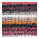 A close-up of a knitted fabric swatch with horizontal stripes in pink, black, gray, white, and orange, showing a textured knit pattern.