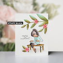 Card with a woman sitting on a bench and flowers, featuring 'Penny Black' branding.
