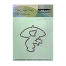 Penny Black Creative Dies for umbrellas cut out on a green cardstock packaging.