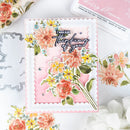 Floral card with 'I was just thinking of you' text, surrounded by floral elements and ink pads.