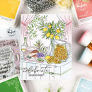 Colorful card with a lemon-themed design surrounded by craft supplies
