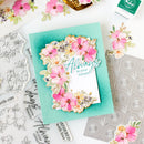 Card with floral design and 'Always in your corner' text, surrounded by floral elements and stamps.
