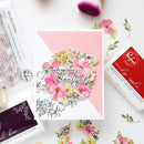 Floral card with 'Happy Birthday Beautiful' text on a pink background, surrounded by stamping tools.