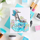 Card with high heel shoe design and 'Celebrate in style' text, surrounded by makeup items on a light background.