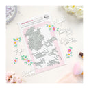 Metallic die cut shapes on a pink card with floral designs and text