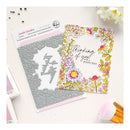 Stamps and die set with floral design and text on a white background