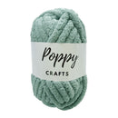 Skein of green yarn with a 'Poppy Crafts' label on a white background