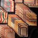 Collection of wooden flags with various designs on a black background
