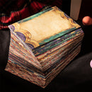 Stack of colorful trading cards with a decorative cover on a dark surface