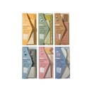 Set of six small notebooks with different colored covers on a white background