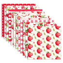 Set of paper placemats with red apple patterns on a white background